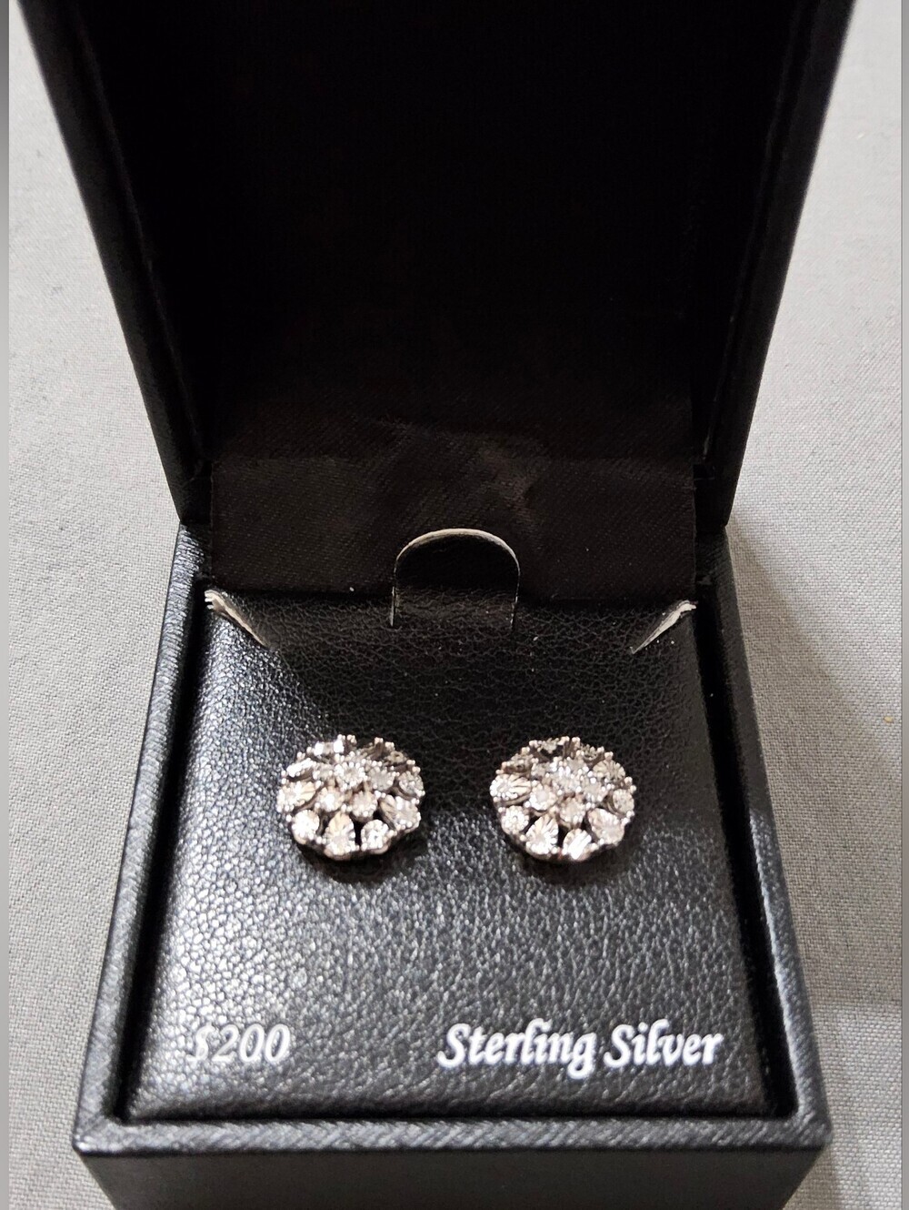 Diamond Flower Burst Stud Earrings (1/10 ct. t.w.) in Sterling Silver,
